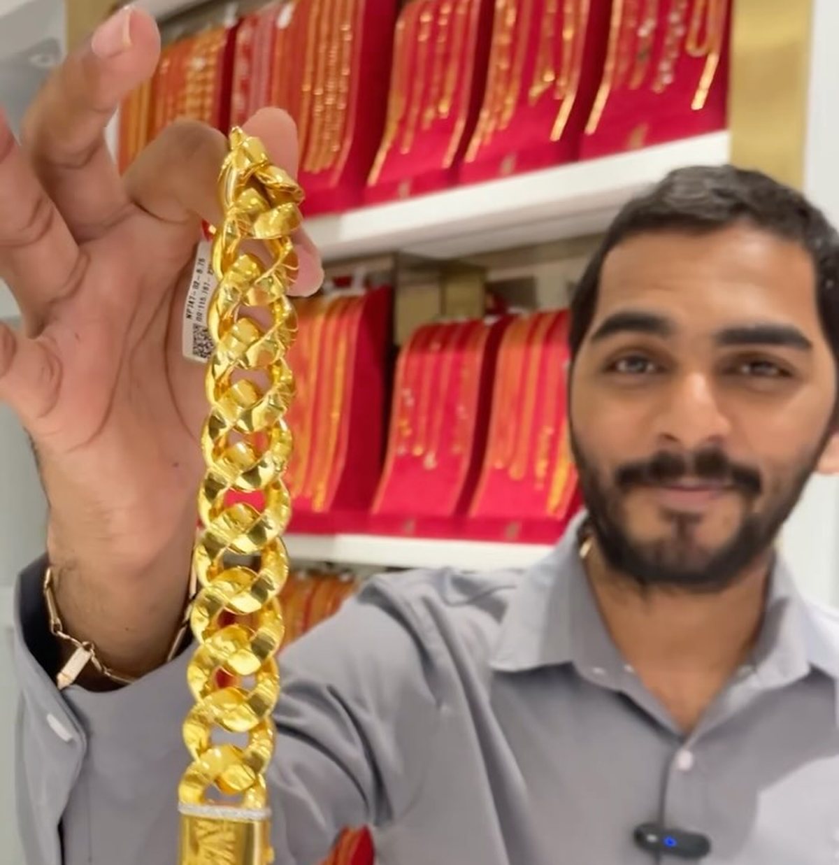 A heavy 22K gold Cuban link chain held up at the Nakoda Gold counter